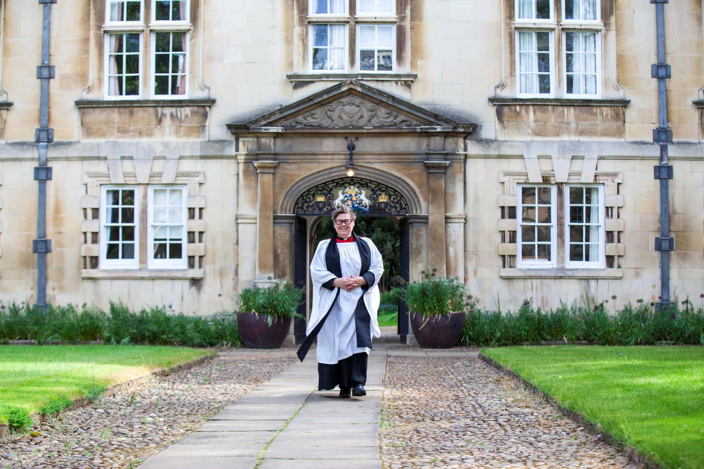 Helen Orchard robed walking through Second Court