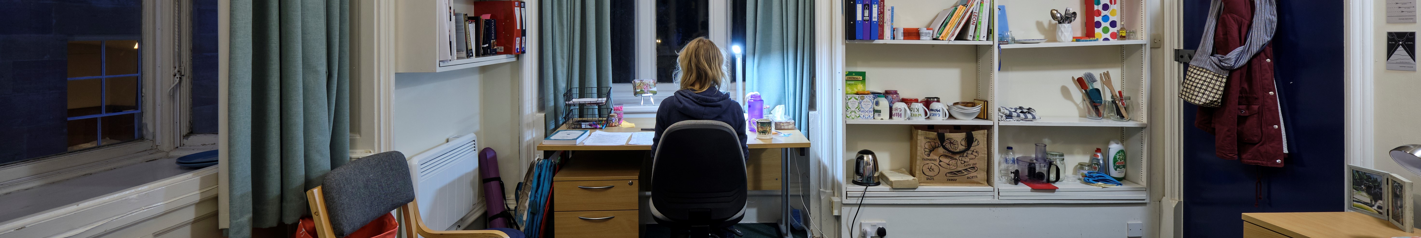 Student at desk, facing away