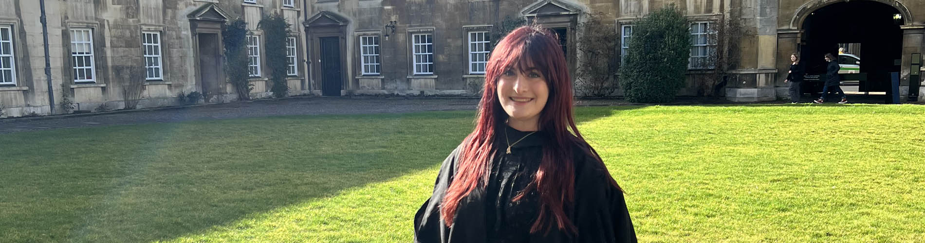 Person from shoulders up with long red hair