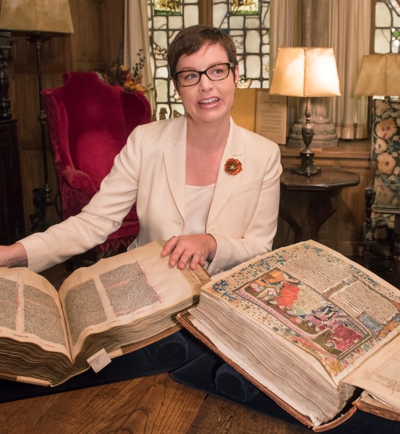 Mary Franklin Brown with two medieval manuscripts