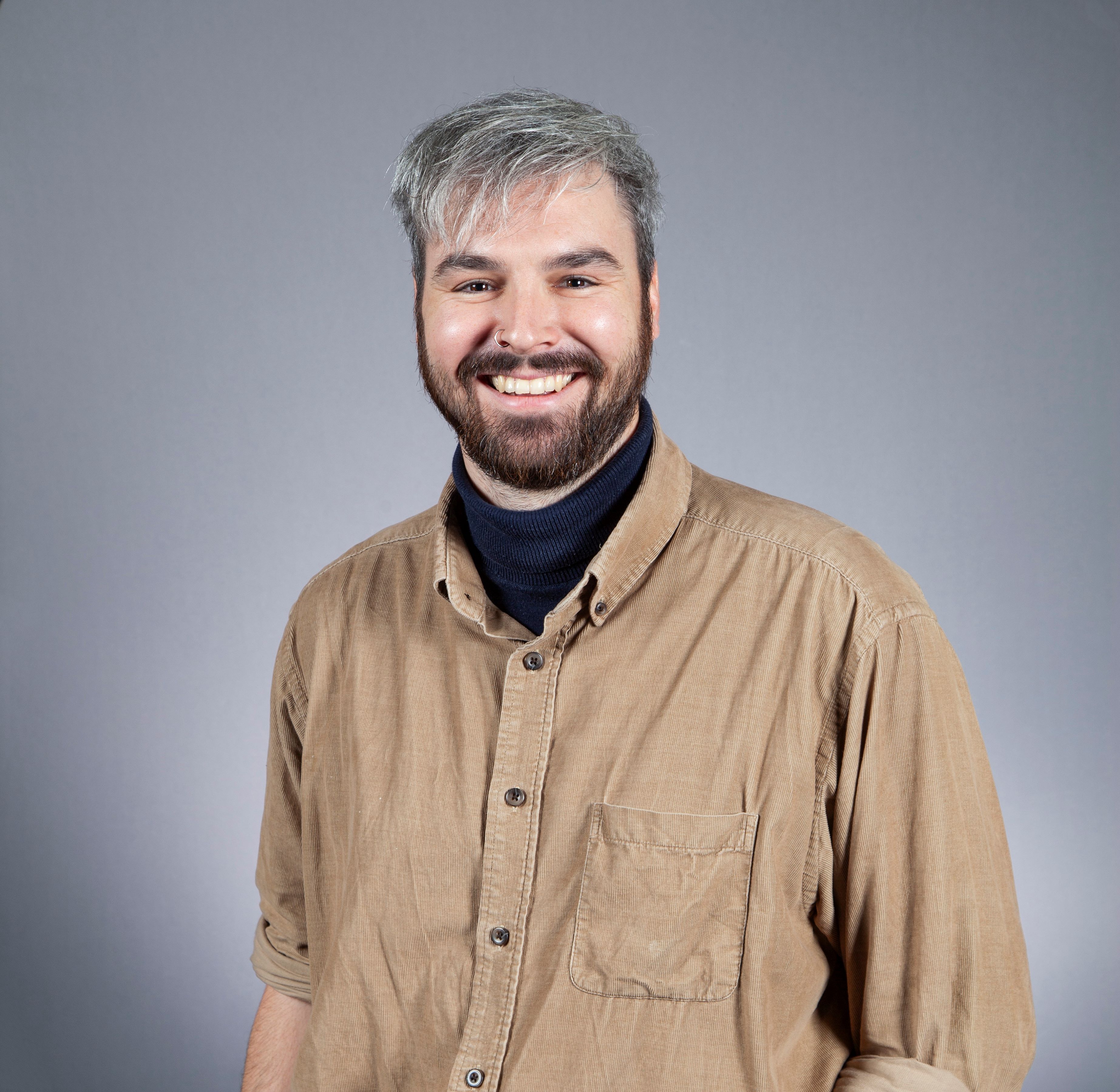 Smiling person with beard