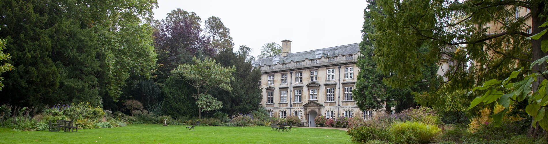 Trees, grass and an old building