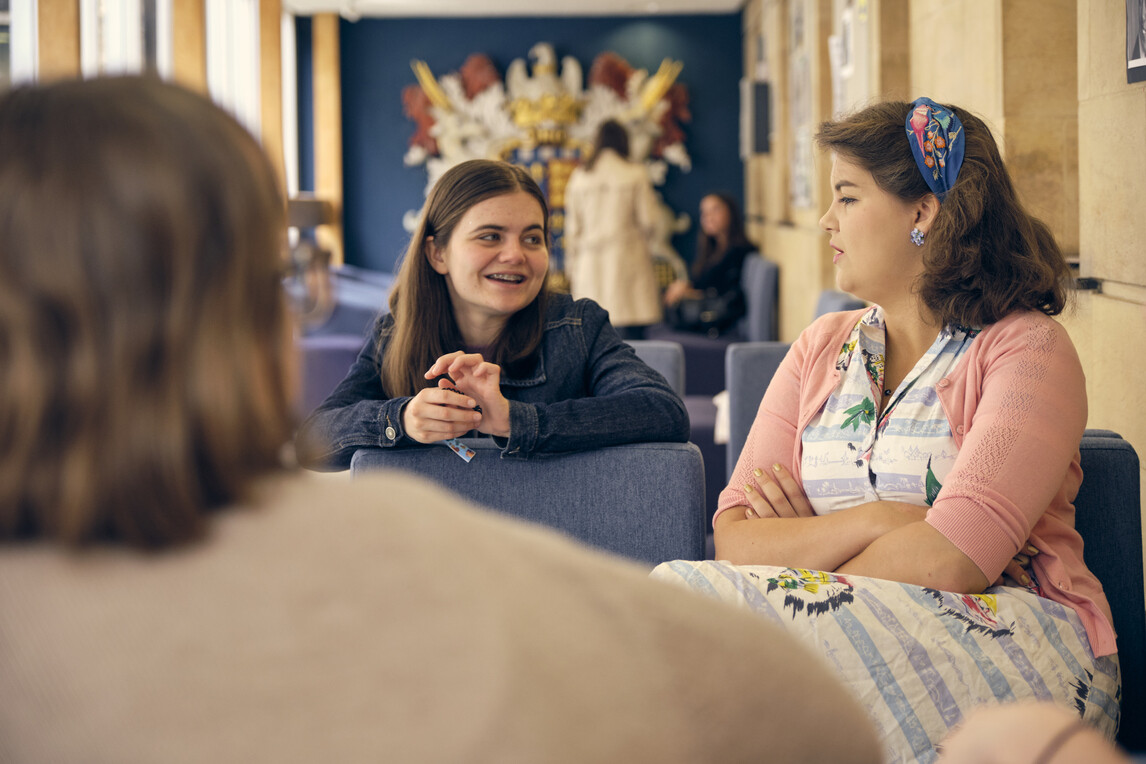 Students talking in the Library corridor