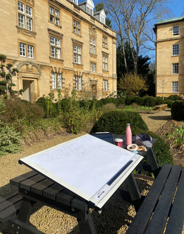 Drawing board on a picnic bench in front of the Stevenson building in Third court