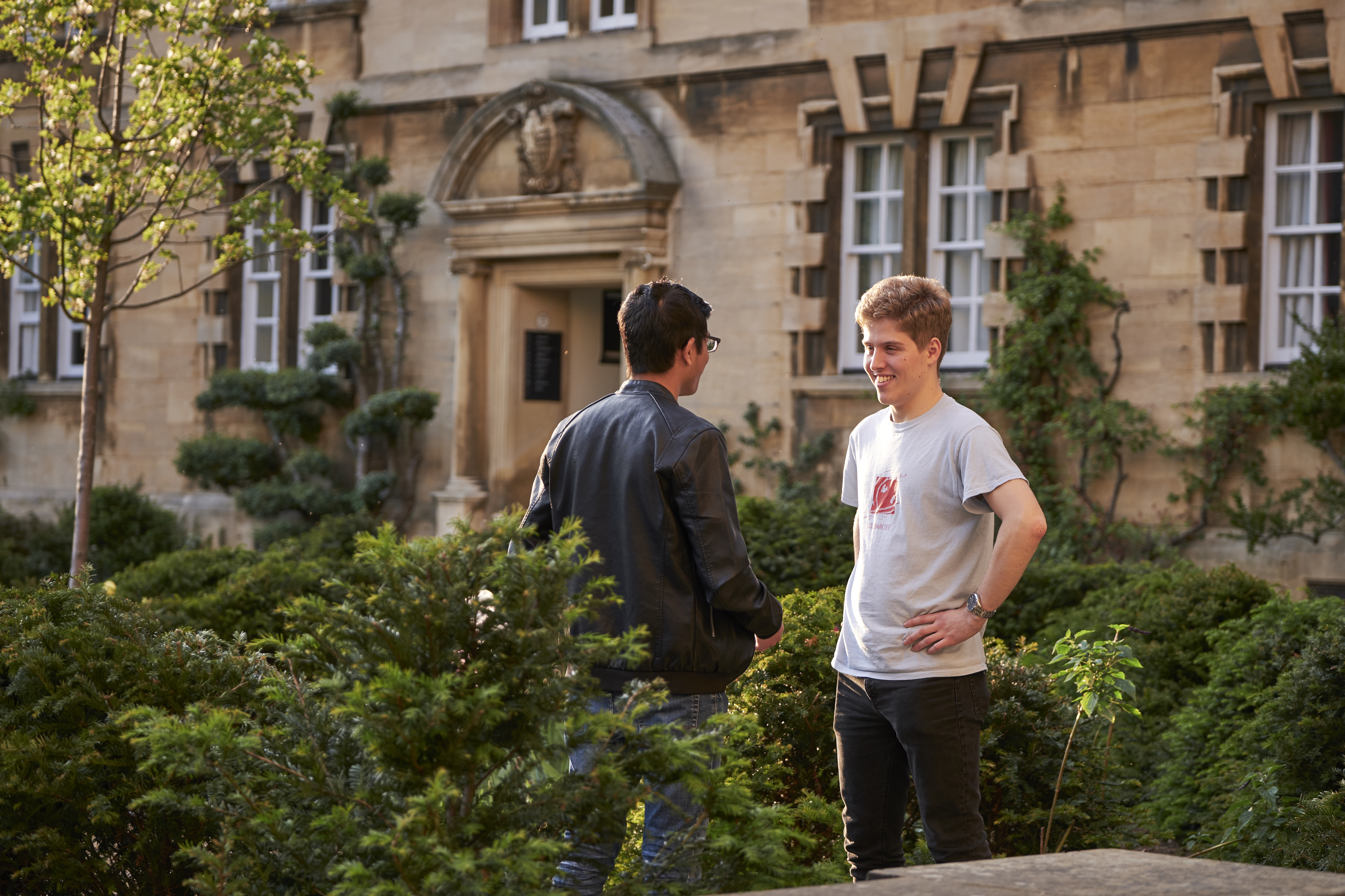 Two students talking in Third Court