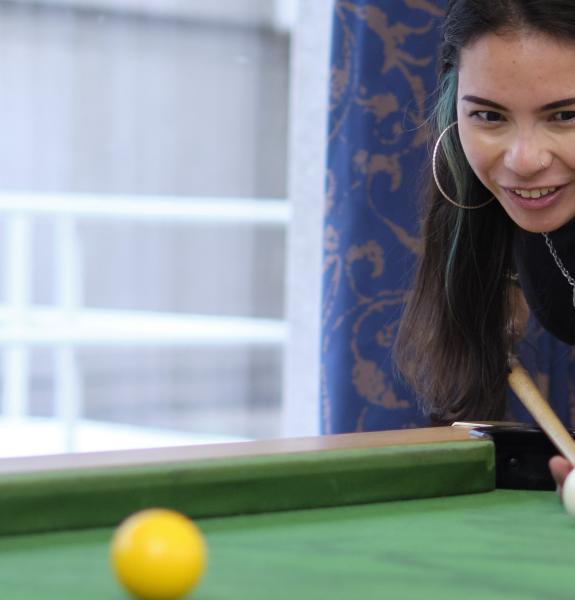 Student playing pool