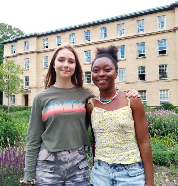 Headshots of Amelia and Adanna in College gardens