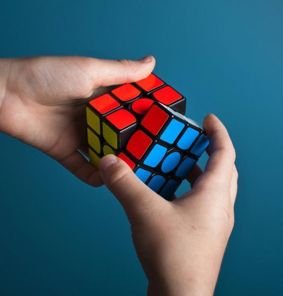 Hands holding a rubik's cube