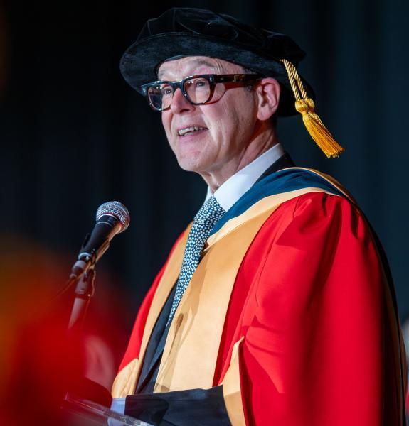 Person in red academic robes