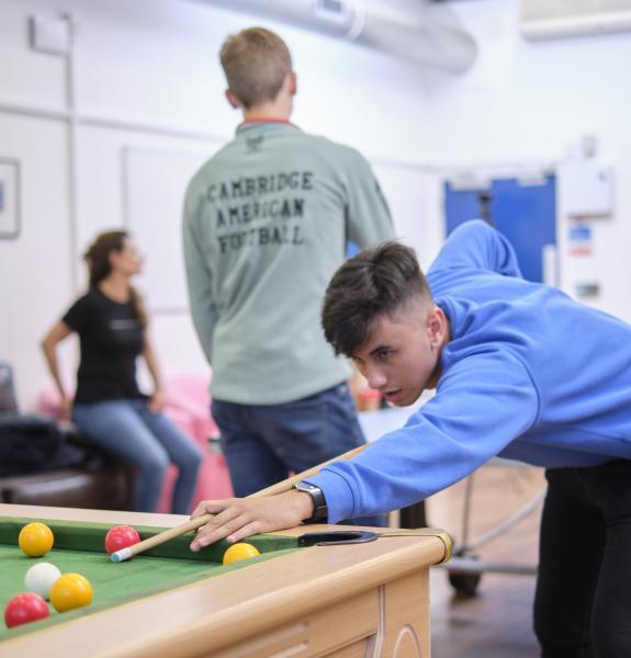 Person playing snooker