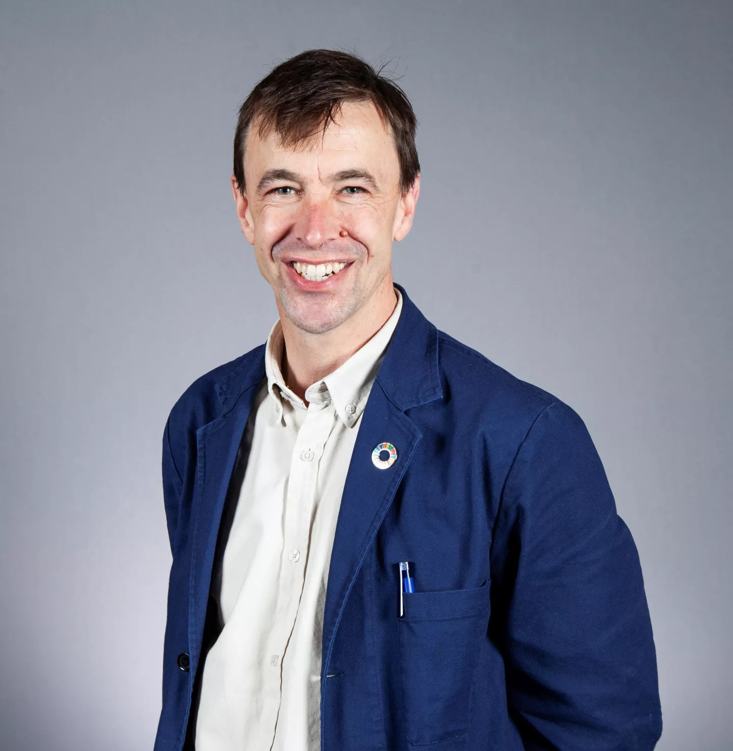 Rob Doubleday headshot wearing blue jacket