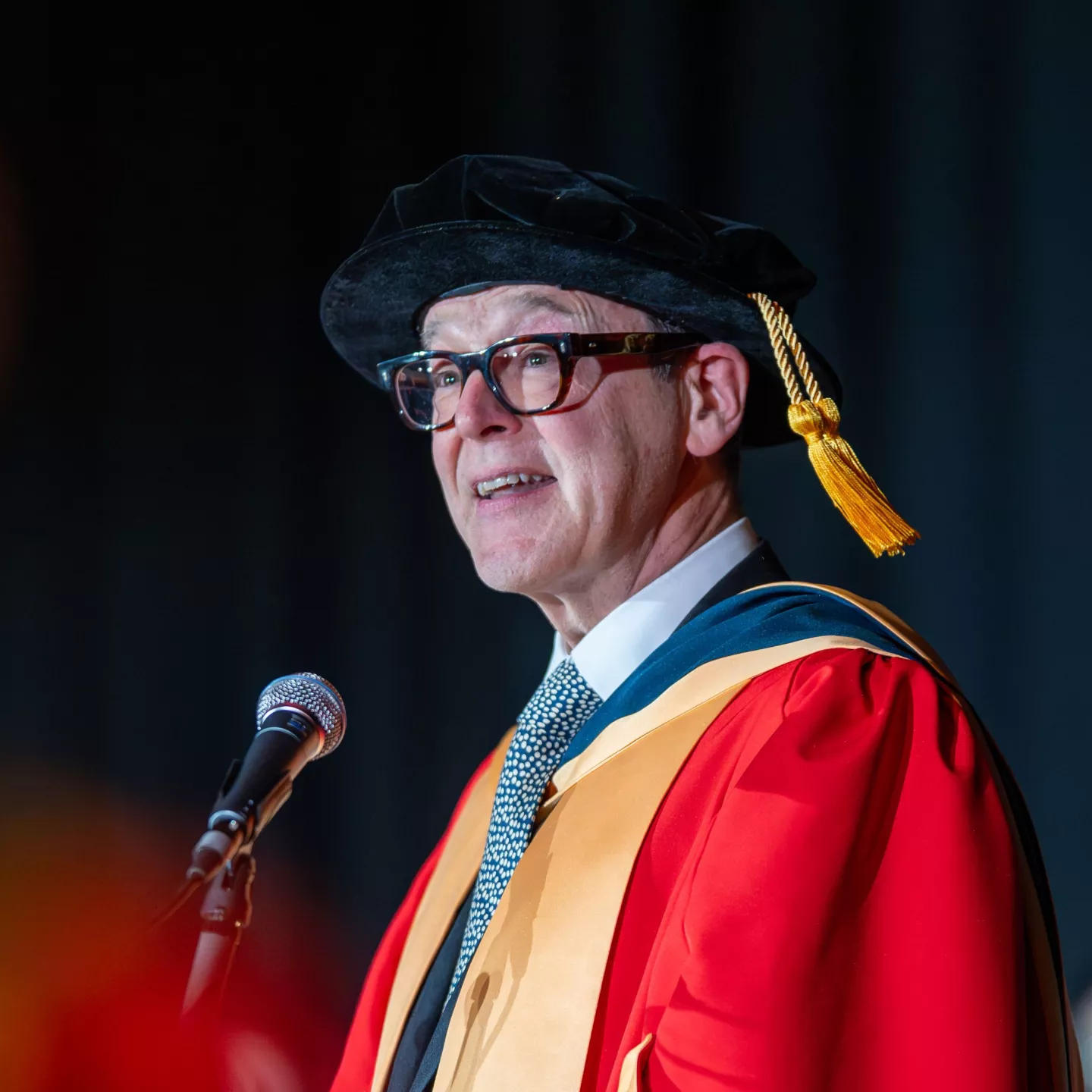 Person in red academic robes